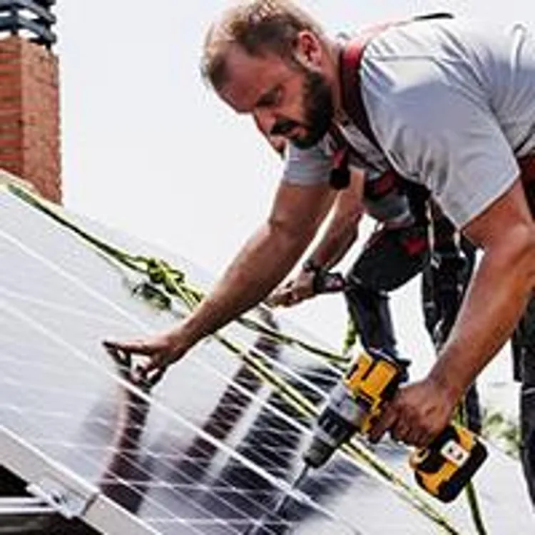 technicians installing solar panels