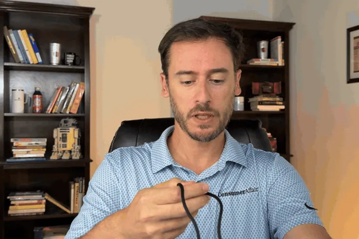 Chris Kolmar adjusting the ADT On-the-Go pendant's lanyard
