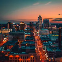 city skyline and main thoroughfare at nighttime