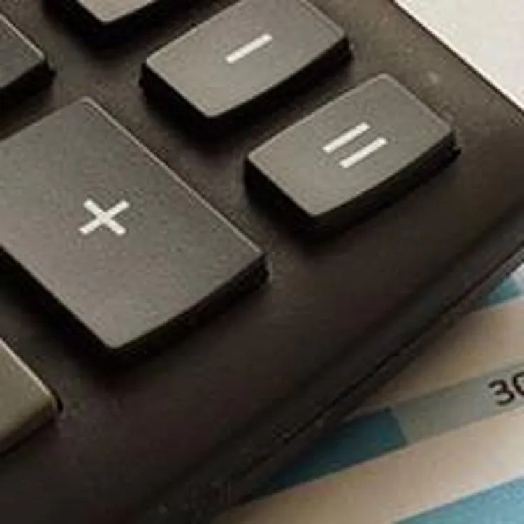 certificate of deposit and paper with bar graphs and calculator on the side