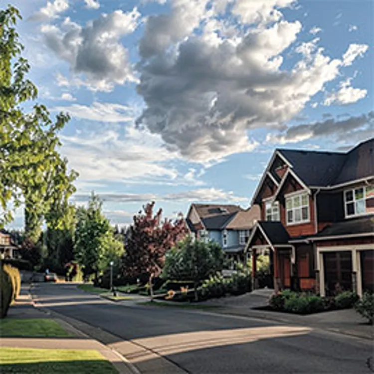 image showing a residential street with mid-sized homes
