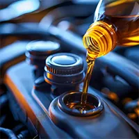 oil being poured into car engine