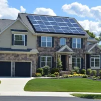 a two-storey house in New Jersey with solar panels on the roof