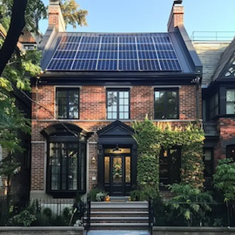 a row house with solar panels on the roof
