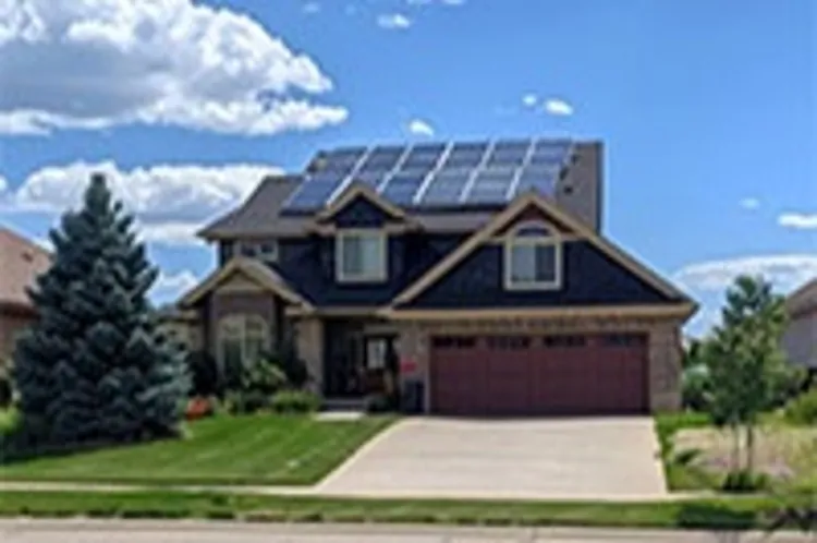 two-story wyoming home with solar panels installed on the roof