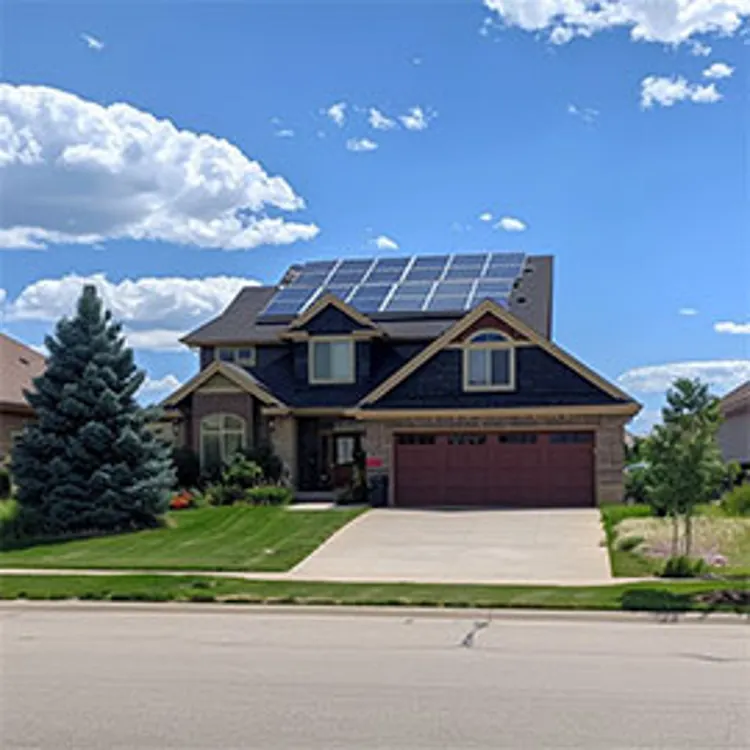 two-story wyoming  home with solar panels installed on the roof