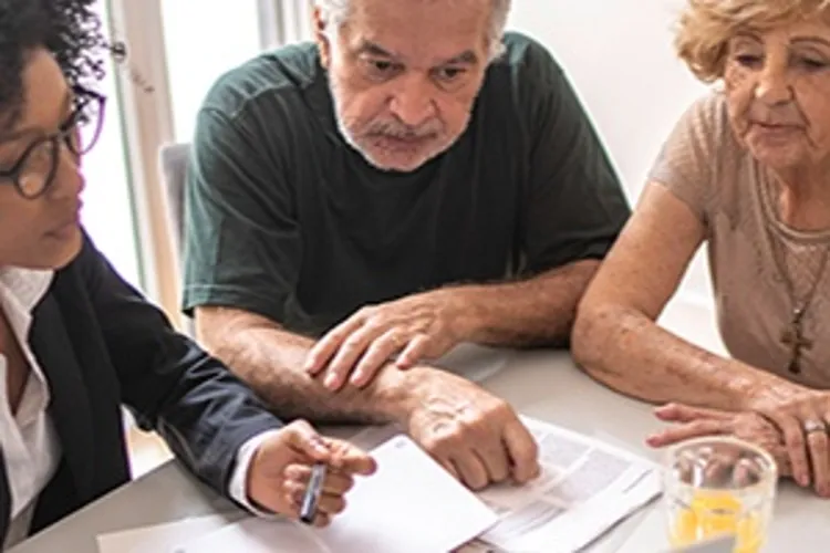 attorney speaking to older couple