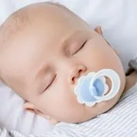 baby sleeping with pacifier