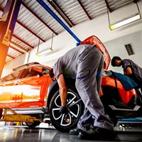 car undergoing maintenance inspection