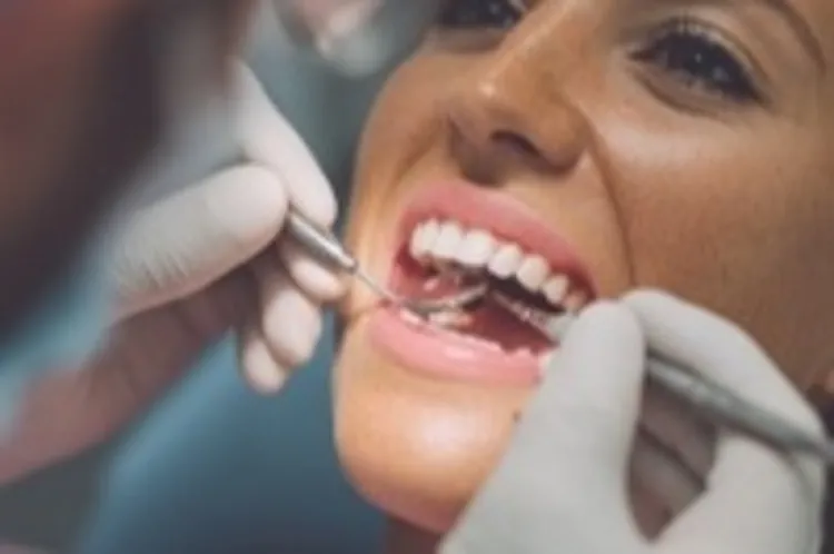 a woman having her teeth checked