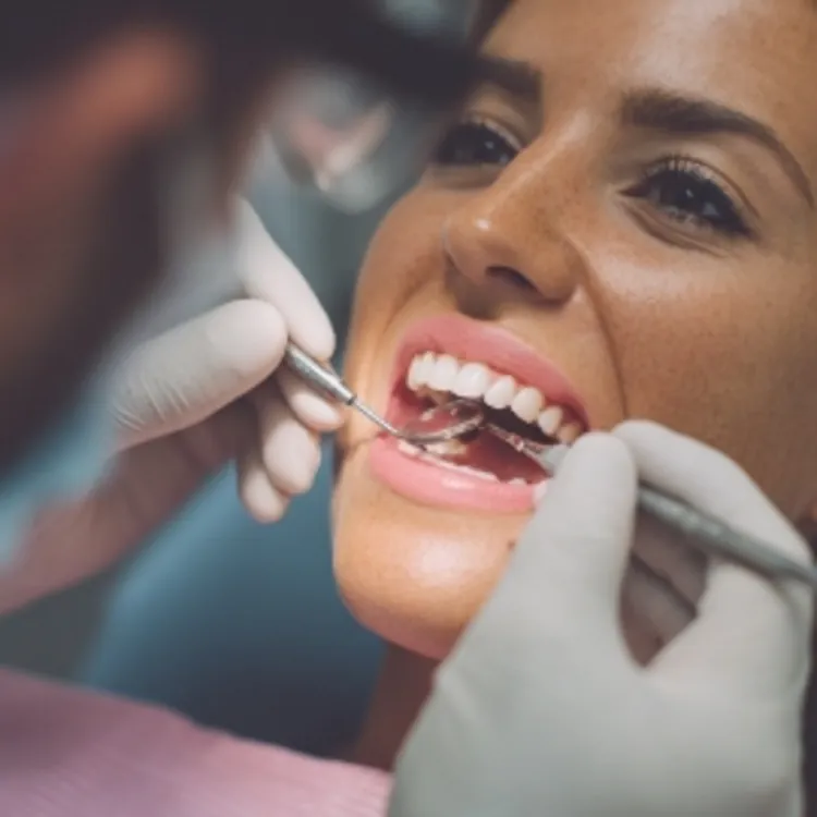 a woman having her teeth checked