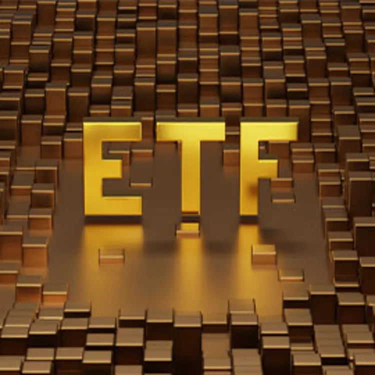 gold etf letters on top of metal bars