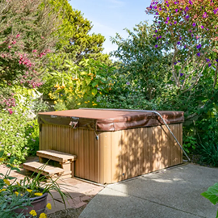 green hot tub cover in lawn