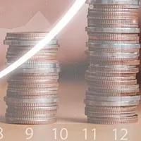 stacks of coins progressively increasing representing growth within a year