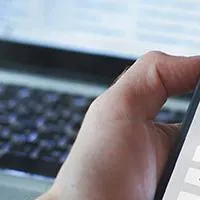 person looking at credit score on their cell phone