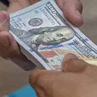 man giving money to another man