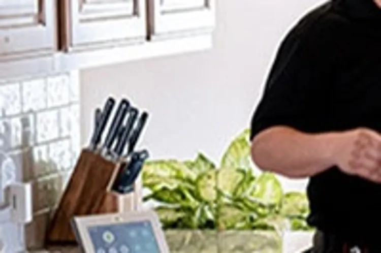 woman homeowner talking with home security installer
