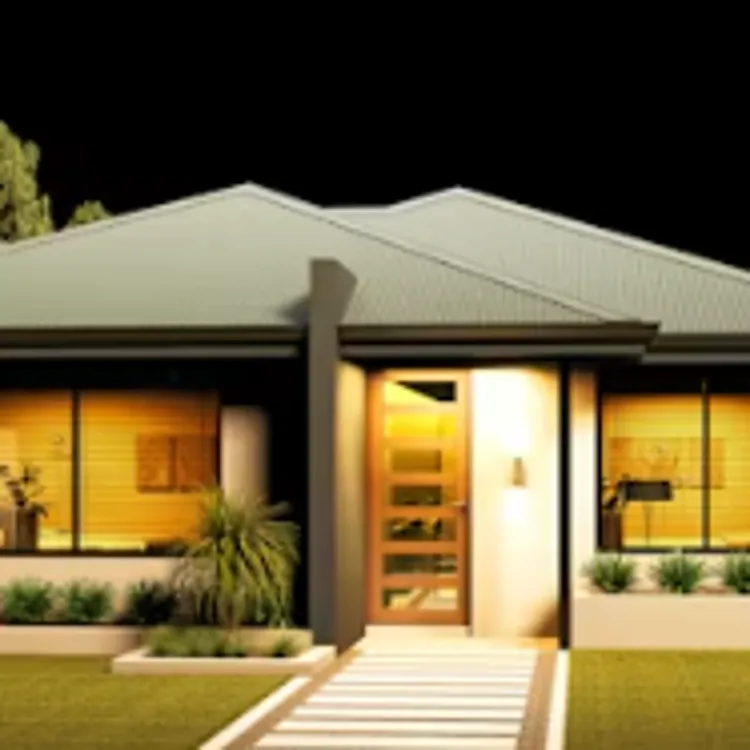 Modern single story house with lit windows and landscaped front yard at night
