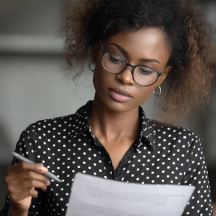young lady filling out a loan application form