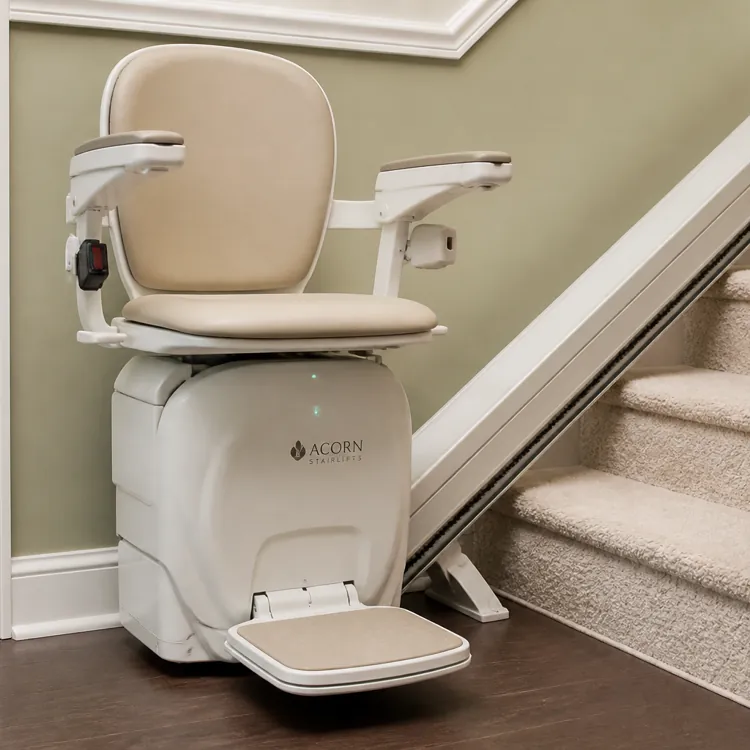 Motorized stair lift chair installed next to a carpeted staircase in a home interior