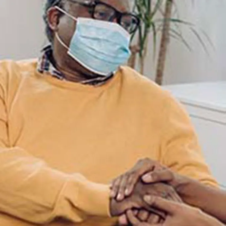 caregiver talking to senior patient