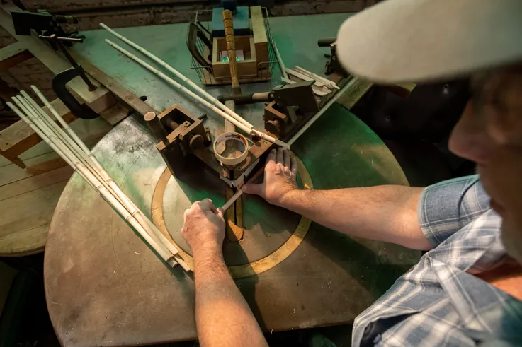 furniture factory worker using equipment