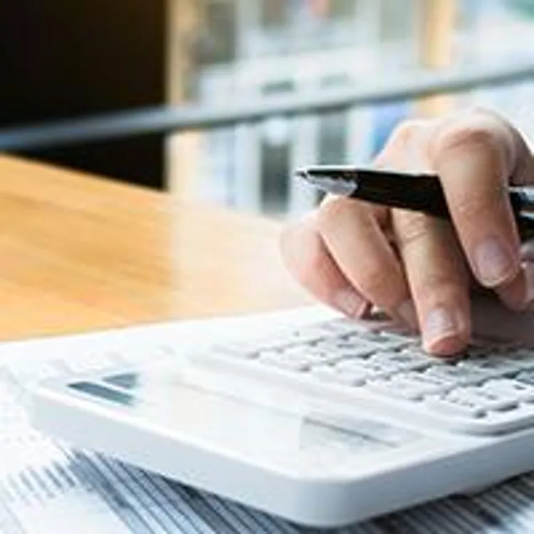 credit counselor with calculator