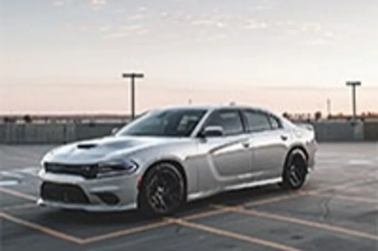 a silver chrysler parked in an empty parking lot