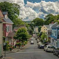 residential area street with parked cars and colorful houses in connecticut