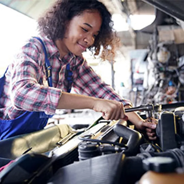 mechanic working on the engine of the car