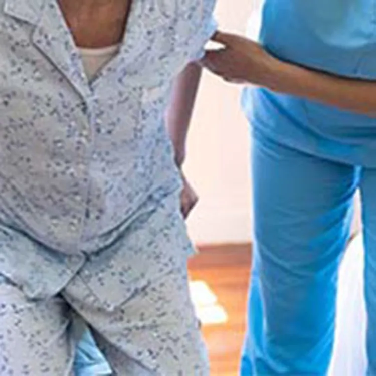 in-home care nurse helping woman out of wheelchair