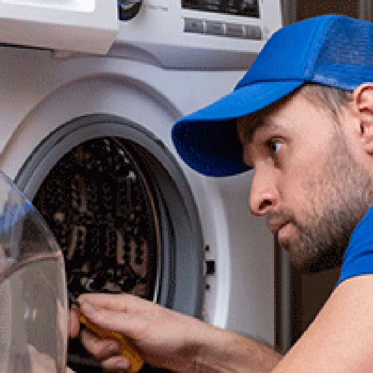 technician repairing washer