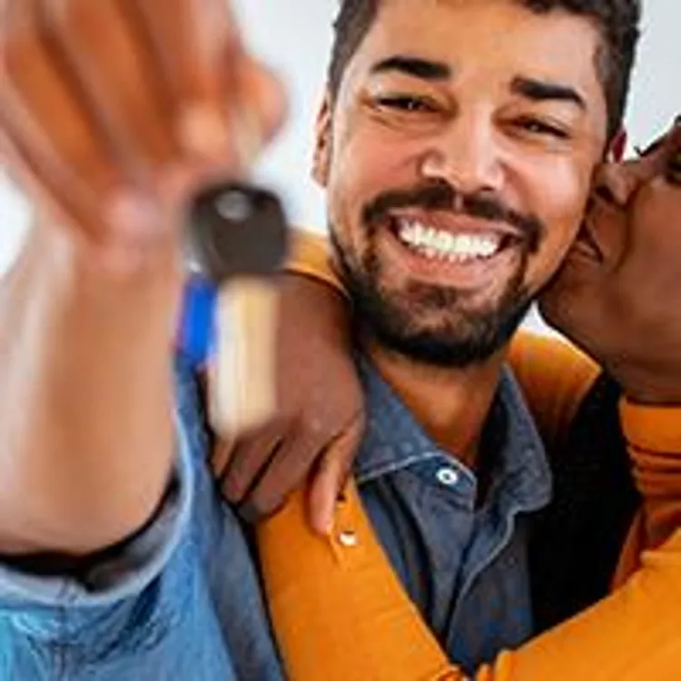 couple holding house key