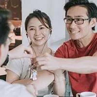 couple receiving house keys from agent