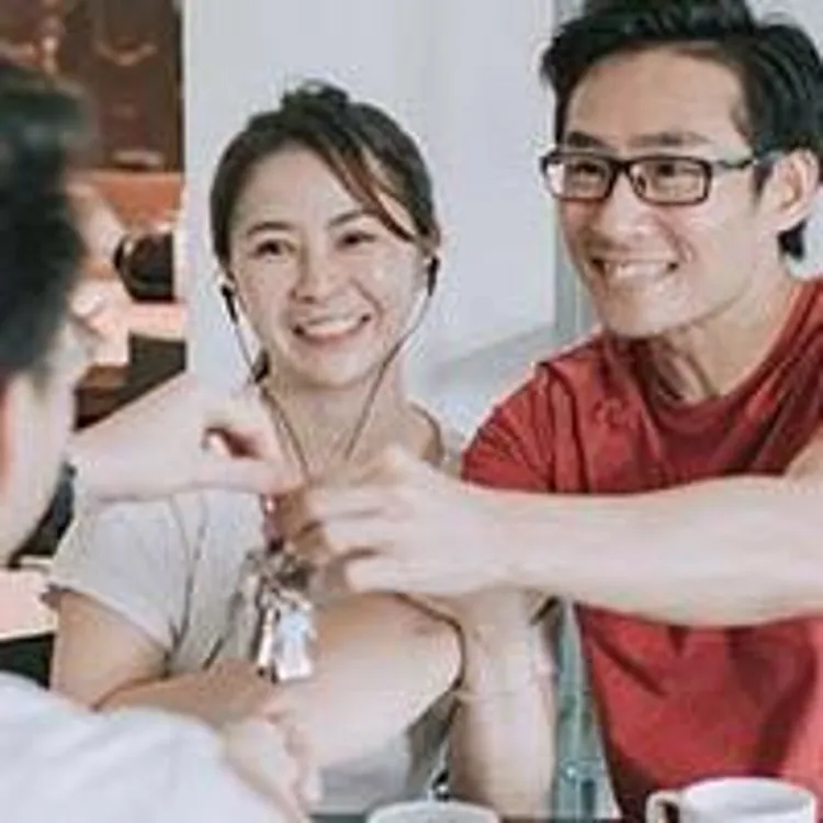 couple receiving house keys from agent
