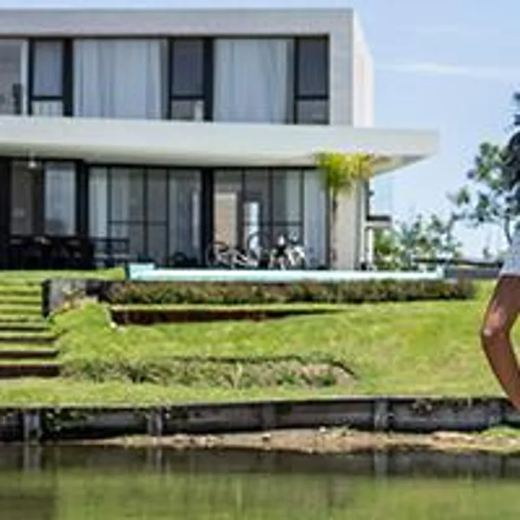 couple standing in front of home