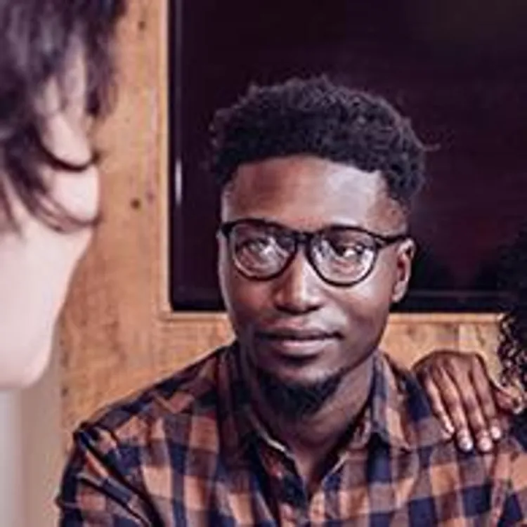 couple talking to pregnancy doctor