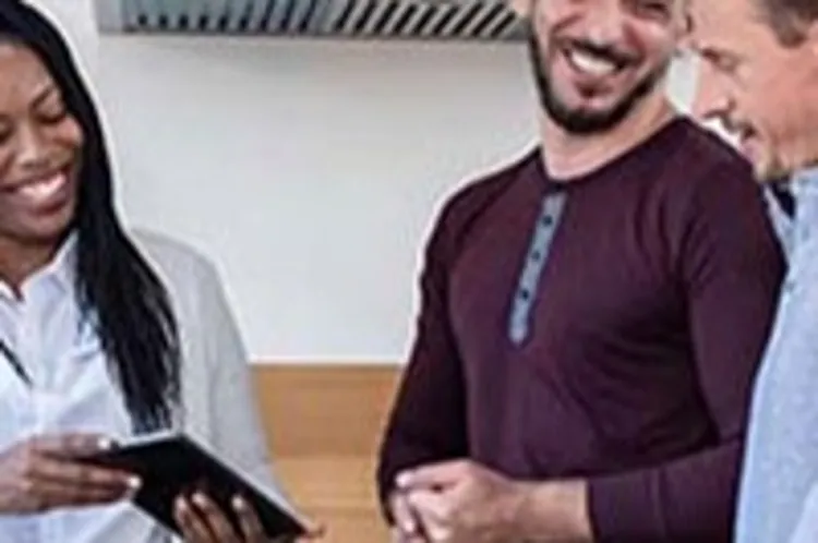 couple talking to real estate agent