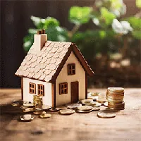 miniature house and stack of coins