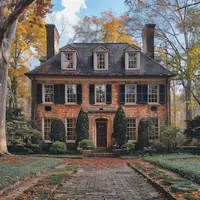a house with a cobblestone path in front