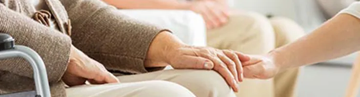 caregiver comforting older adult