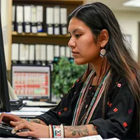 native american woman working on the computer