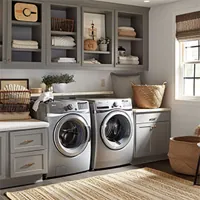 washer side by side with dryer in a laundry room