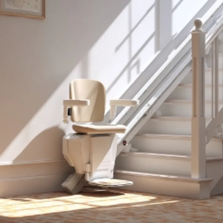 a white stairlift at the foot of a staircase