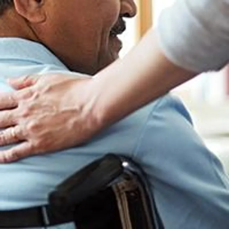 elderly man with caregiver