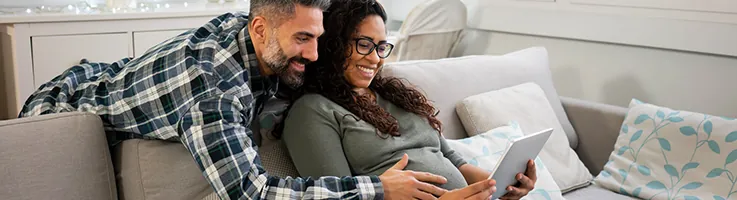 expecting couple smiling