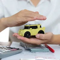 toy car placed in between two hands
