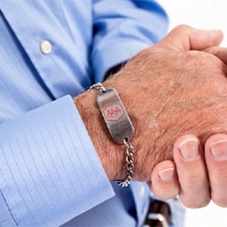 senior man wearing a medical alert bracelet