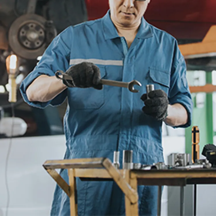 car technician holding tools