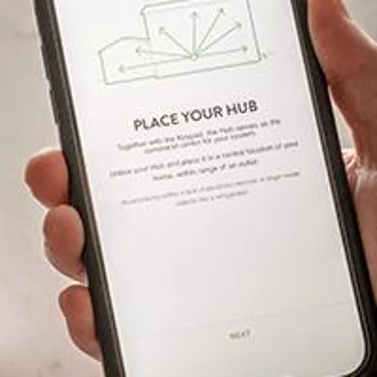 person setting up their frontpoint security system via phone app